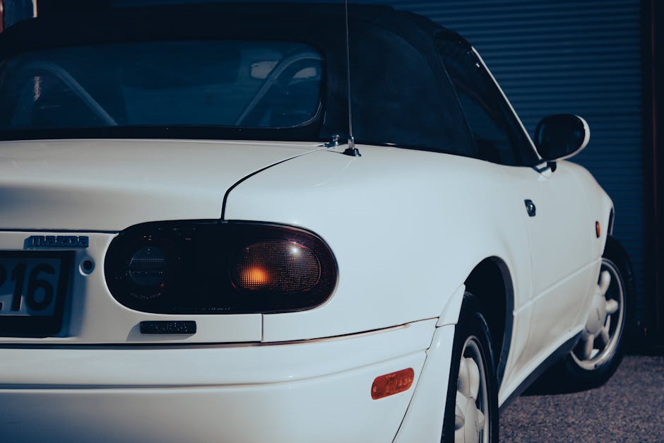 Luxury white convertible car representing premium auto insurance